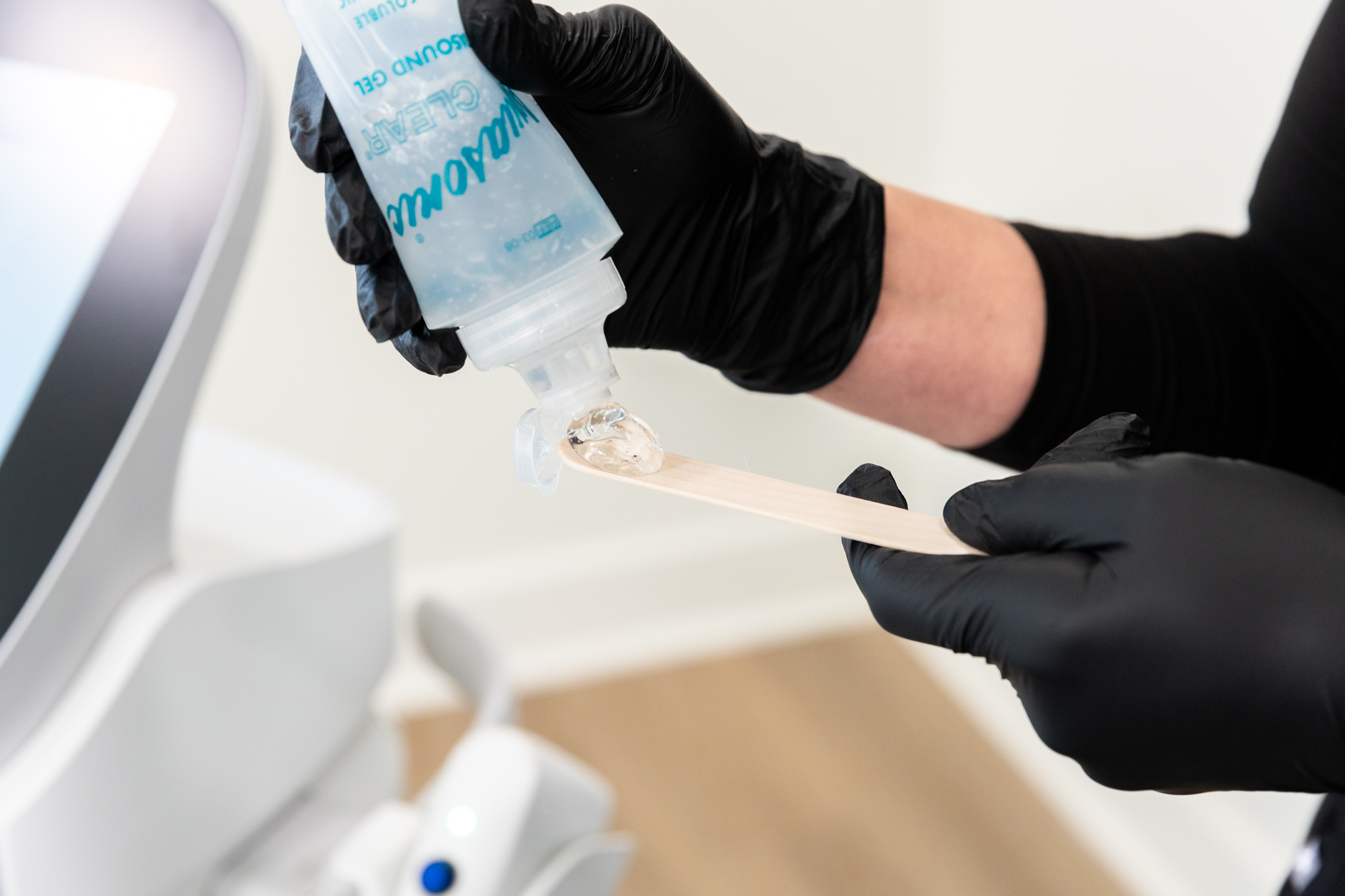 A medical provider is preparing ultrasound gel for Sofwave near McCandless, PA